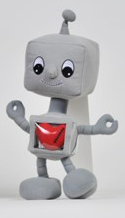 A stuffed robot with a red heart in its mouth.